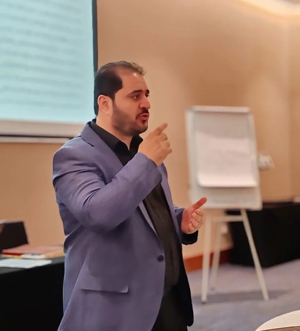 Dr Muaffaq Aqel teaching a training course